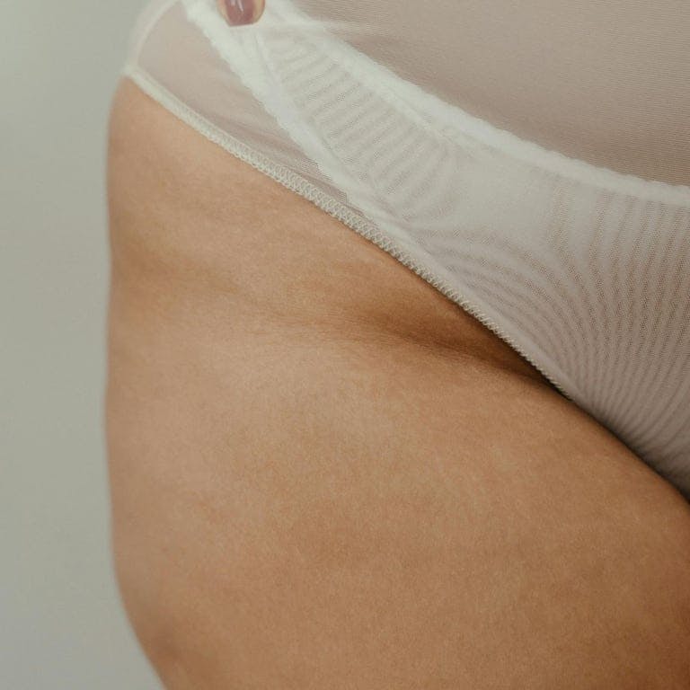 thigh of woman in her underwear