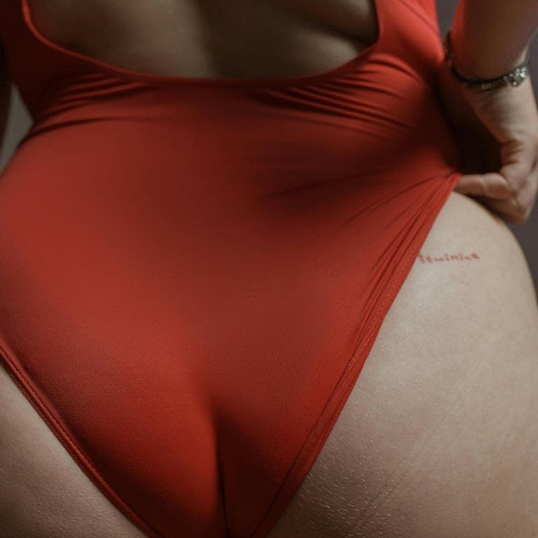woman backside wearing red underwear