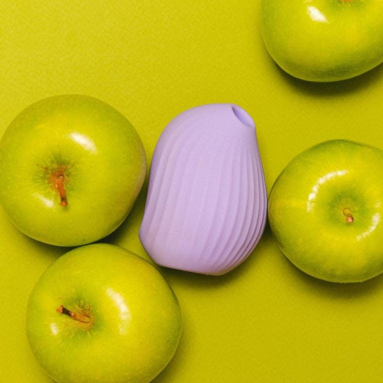 purple suction vibrator with green apples