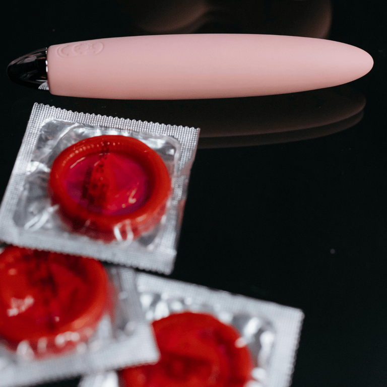 Condoms and a pink bullet vibrator