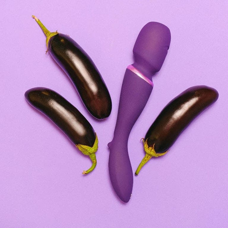 purple wand vibrator with eggplants around