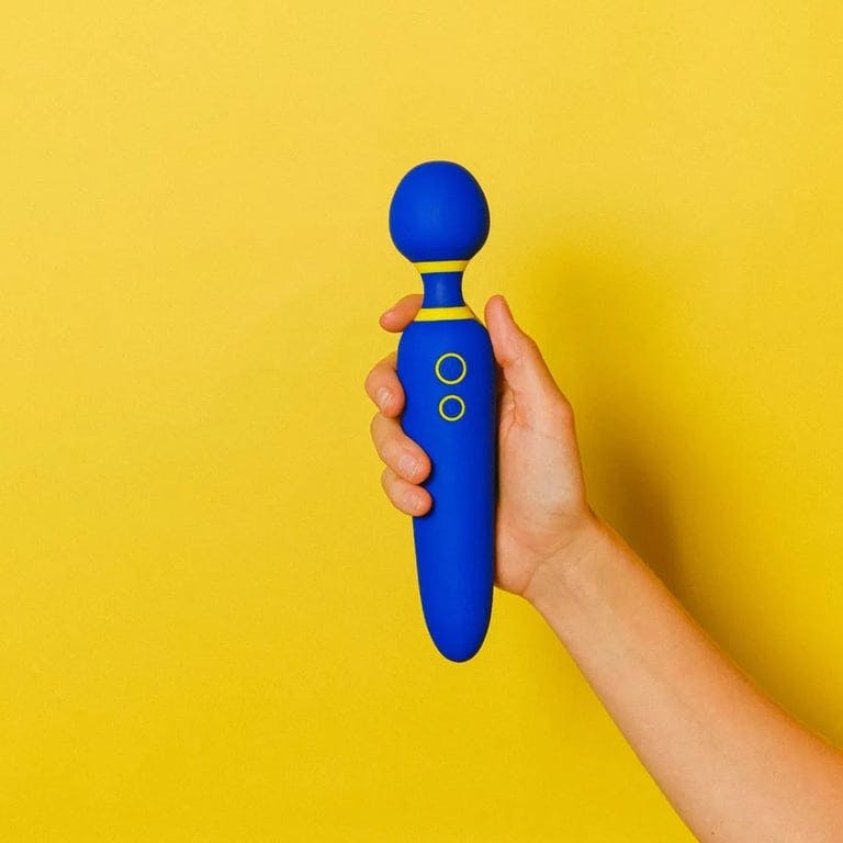 person holding blue wand vibrator