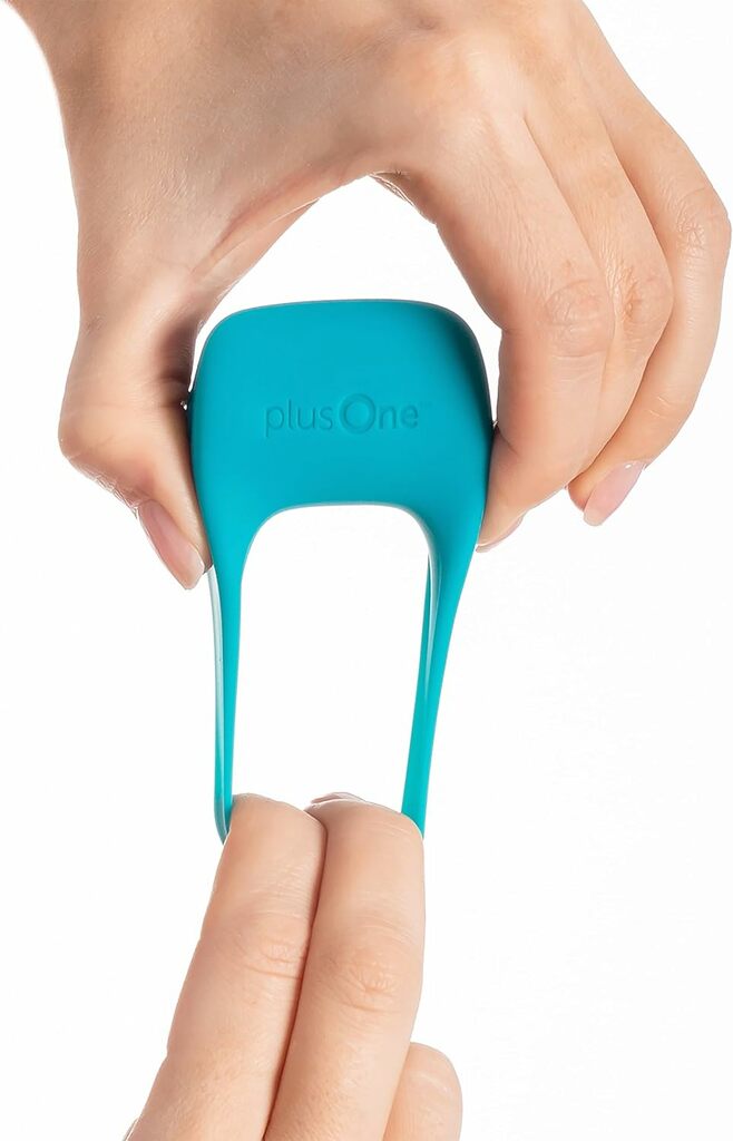 PlusOne Vibrating Cock Ring showing its stretchy silicone material PlusOne Vibrating Cock Ring showing its stretchy silicone material